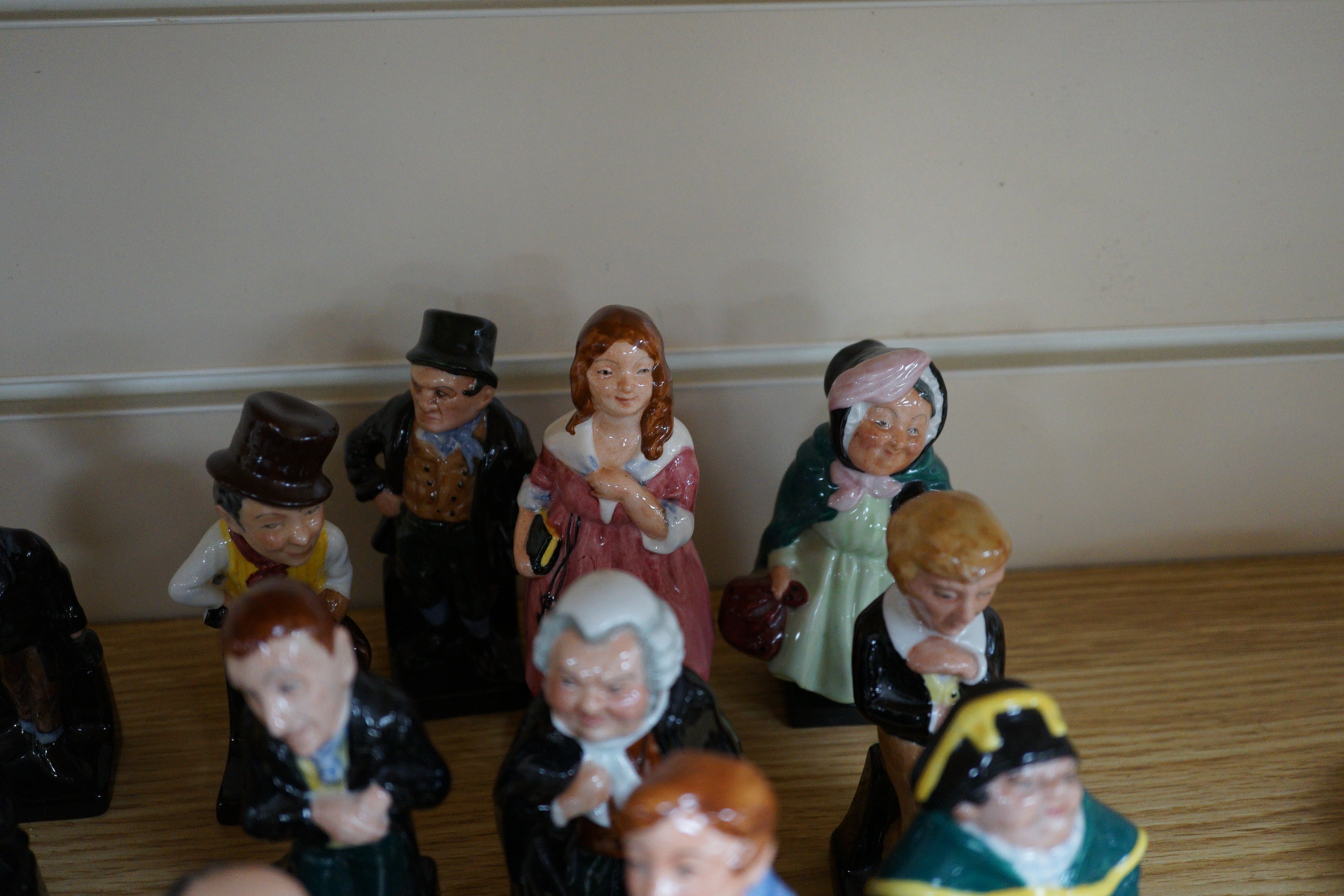 A group of twenty five Royal Doulton Dickens characters